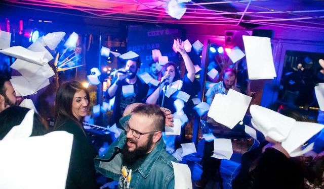 Guests throwing napkins on the dance floor