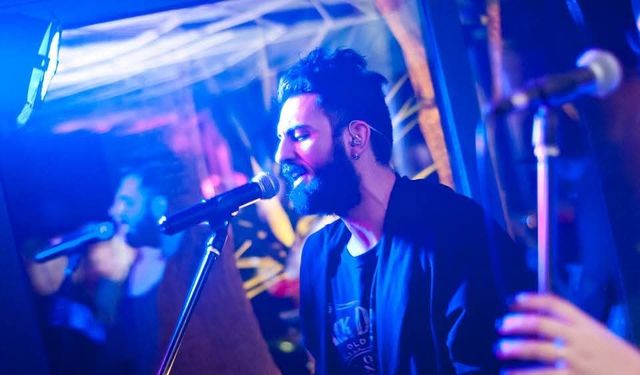 Singer performing at Cozy