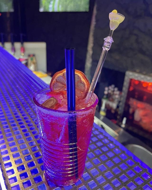 A specialty cocktail on the Cozy bar