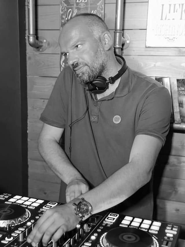 The DJ at the decks at Cozy Club