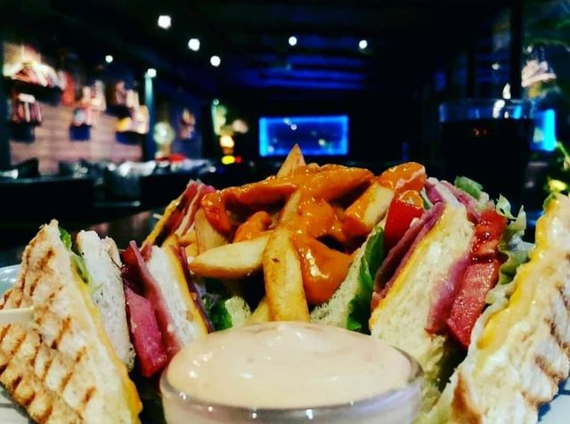 Club sandwich with fries